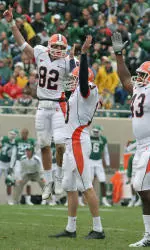 Frank Lenti Jr., Jason Reda, center, and Sam Carson III celebrate Reda's game-winning field goal with six seconds remaining.