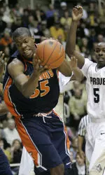Shaun Pruitt grabs a rebound in front of Purdue guard Keaton Grant during the first half.