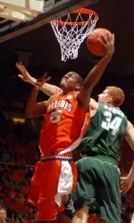 Shaun Pruitt goes up for a basket as Michigan State's Drew Naymick tries to block him during the first half Tuesday. (Heather Coit/AP)