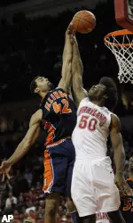 Brian Randle goes to the basket against Maryland's Bambale Osby during the second half. (AP)