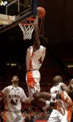 Warren Carter dunks the ball against Michigan.