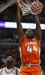 Indiana forward DJ White atches as forward Marcus Arnold dunks.
