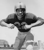 Bobby Mitchell, like Red Grange, had his signature game in a victory over Michigan.