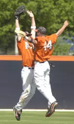 Kyle Hudson (left) and Shawn Roof celebrate Illinois series sweep over Indiana with a soaring chest bump. It was Illinois' first Big Ten series sweep since 2005.