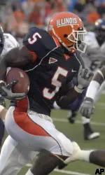 Illinois running back Rashard Mendenhall (5) is chased by Western Illinois' Marshon Royal in the first half. (AP Photo/Robert K. O'Daniell)