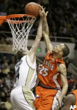 Calvin Brock dunks over Purdue's Robbie Hummel. (AP Photo/Michael Conroy)