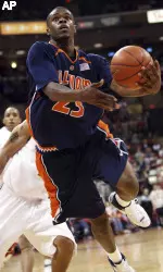 Illinois' Rodney Alexander (23) drives to the basket past Ohio State defenders during the second half (AP Photo)