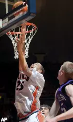 Calvin Brock shoots in front of Northwestern's Jeff Ryan in the first half.