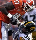 Jeff Cumberland holds onto a pass over Iowa's Kyle Spading during the first half. (AP Photo)