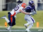 Garrett Edwards brings down Northwestern's Eric Peterman during the first quarter. (AP Photo/Nam Y. Huh)