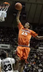 Mike Davis goes up for a dunk over Purdue guard Lewis Jackson in the first half. (AP Photo/Michael Conroy)