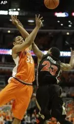 Georgia's Corey Butler attempts to block a shot by Demetri McCamey during the first half. (AP Photo/M. Spencer Green)