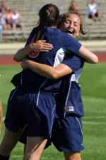 Senior defender Emily Zurrer (5) and junior midfielder Jackie Santacaterina celebrate after Zurrer tallied the game-winner against Dayton.