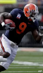 Arrelious Benn rushes through traffic in Illinois' 47-21 rout of Eastern Illinois. (AP Photo/Seth Perlman)