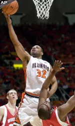 Demetri McCamey shoots over Marcus Landry, right, during the first half.