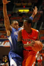 Illinois' D.J. Richardson (1) looks for an open pass under pressure from Presbyterian's Chase Holmes (31). (AP)