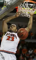 Dominique Keller dunks a basket after a fast break.