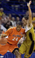 Illinois' Mike Davis, left, tries to find a way around Missouri's Michael Dixon, right, during the first half of an NCAA college basketball game Wednesday, Dec. 23, 2009, in St. Louis. (AP Photo/Jeff Roberson)