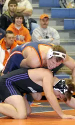 John Dergo won the 184-pound Midlands title Wednesday, topping American's second-ranked Mike Cannon, 11-9, in sudden-victory overtime.