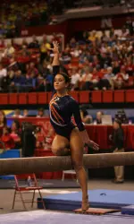 Melissa Fernandez scored two perfect 10s on balance beam and uneven bars to help her and Austin Phillips capture the Mixed Pairs title.