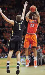 Illinois guard Demetri McCamey (32) puts up a three pointer over Vanderbilt forward Brad Tinsley (1) during the first half of an NCAA college basketball game on Tuesday, Dec. 8, 2009, in Champaign, IL. (AP Photo/Darrell Hoemann)
