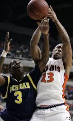 Michigan guard Manny Harris (3) and Jeff Jordan battle for a rebound in the first half. (AP Photo/Michael Conroy)
