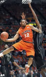Illinois guard Demetri McCamey (32) passes out from under the basket while being guarded by Purdue's JaJuan Johnson during an NCAA college basketball game at Assembly Hall in Champaign, Ill., on Tuesday, Jan. 19, 2010. (AP Photo/Robin Scholz)
