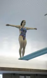 Junior Britni Fisher claimed two events for the Illini to help secure a close victory.