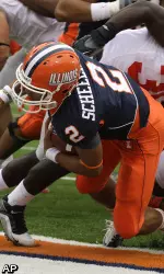 Illinois quarterback Nathan Scheelhaase (2) scores a touchdown past Ohio State defensive back Orhian Johnson (19) during the first half of an NCAA college football game in Champaign, Ill., Saturday, Oct. 2, 2010. (AP Photo/Seth Perlman)