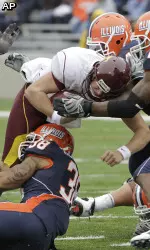 Ian Thomas and Martez Wilson sack Minnesota quarterback Adam Weber during the first half. (AP Photo/Seth Perlman)