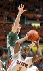 Illinois' D.J. Richardson (1) looks to pass as Michigan State's Mike Kebler (20) defends in the first half of an NCAA college basketball game at the Assembly Hall in Champaign, Ill on Saturday, Feb. 6, 2010. (AP Photo/Heather Coit)