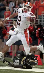 Quarterback Nathan Scheelhaase (2) reaches for extra yardage before being knocked out of bounds by Missouri defensive end Aldon Smith, bottom, during the first quarter. (AP Photo/Jeff Roberson)