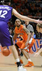 Illinois' Demetri McCamey looks for an opening during the first half. (AP Photo/Heather Coit)