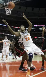 Illinois' Myke Henry (20) rebounds the ball against Nevada's Quintrell Thomas (1) and Mike Moser (43) during the first half.