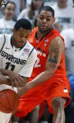 Demetri McCamey, above, and Mike Davis finished the night with 15 points each while Brandon Paul had 12.