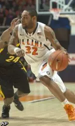 Illinois' Demetri McCamey (32) gets past Bryce Cartwright (24) during the first half of an NCAA college basketball game in Champaign, Ill., Saturday, Feb. 26, 2011. (AP Photo/Robert K. O'Daniell)