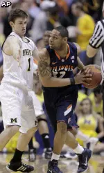Illinois guard Demetri McCamey drives against Michigan guard Stu Douglass in the first half. (AP Photo/Michael Conroy)