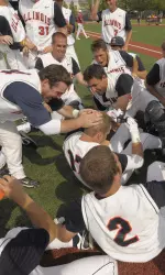 Teammates mob Matt Dittman after his walk-off home run gave the Illini a share of the Big Ten title.