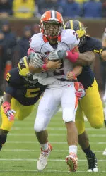 Illinois quarterback Nathan Scheelhaase runs the ball against Michigan.