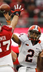 Nathan Scheelhaase threw for one touchdown and ran for another in Illinois' 31-14 loss at Wisconsin.