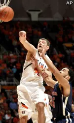 Illinois' Tyler Griffey, left, tips the ball away from St. Francis' Jalen Cannon during the first half. (AP Photo/John Dixon)