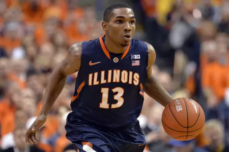 Dec 21, 2013; Saint Louis, MO, USA; Illinois Fighting Illini guard Tracy Abrams (13) dribbles the ball up the court against the Missouri Tigers during the first half at Scottrade Center. Mandatory Credit: Jasen Vinlove-USA TODAY Sports