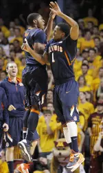 Illinois' D.J. Richardson (1) celebrates with Brandon Paul (3) during the Illini win at Minnesota. (AP Photo/Genevieve Ross)