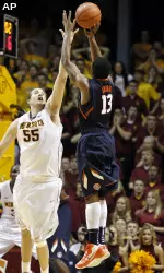 Tracy Abrams (13) hit a dagger three-pointer with 18.1 seconds left in Illinois' 57-53 win at Minnesota. (AP Photo/Genevieve Ross)