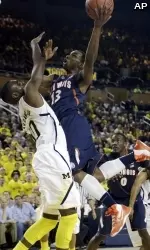 Tracy Abrams shoots over Michigan guard Tim Hardaway, Jr.