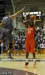 Tracy Abrams shoots against Northwestern's Tre Demps in the first half.