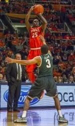 Kendrick Nunn shoots a three over Michigan State's Alvin Ellis III.