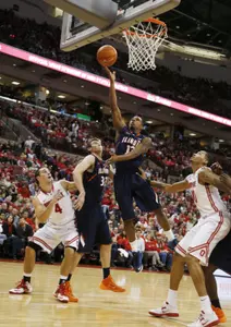 Jan 23, 2014; Columbus, OH, USA; Illinois Fighting Illini guard Tracy Abrams (13) lays the ball in against Ohio State Buckeyes forward LaQuinton Ross (10) at the Schottenstein Center. Ohio State defeated Illinois 62-55. Mandatory Credit: Brian Spurlock-USA TODAY Sports