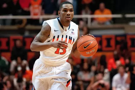Jan 4, 2014; Champaign, IL, USA; Fighting Illini guard Tracy Abrams (13) brings the ball down court during the first half. Bradley Leeb-USA TODAY Sports