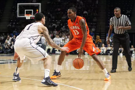 Feb 9, 2014; University Park, PA, USA; Illinois Fighting Illini guard Tracy Abrams (13) dribbles the ball as Penn State Nittany Lions guard John Johnson (1) guards during the second half at Bryce Jordan Center. Illinois defeated Penn State 60-55. Mandatory Credit: Matthew O'Haren-USA TODAY Sports